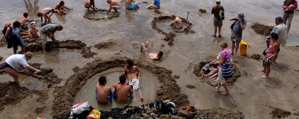 Mass excavations on Hot Water Beach
